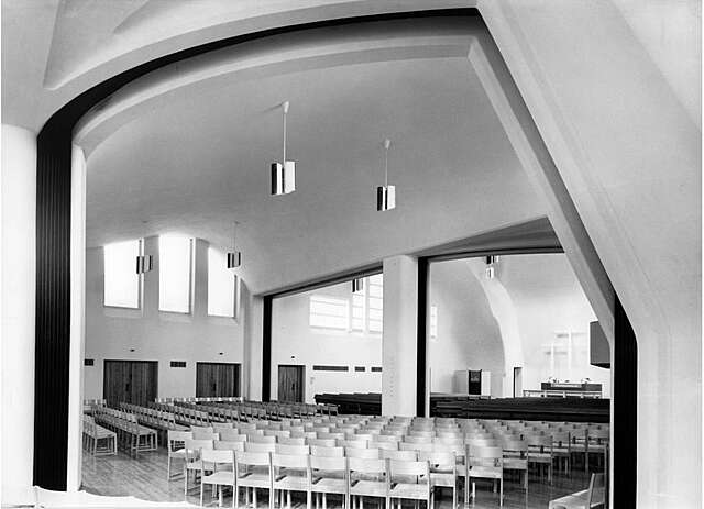 BW photo of a white church interior