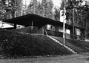 Wooden sauna on a hill.