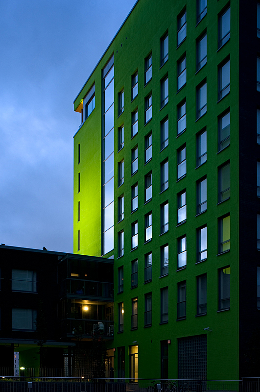 Bright green façade with multiple windows