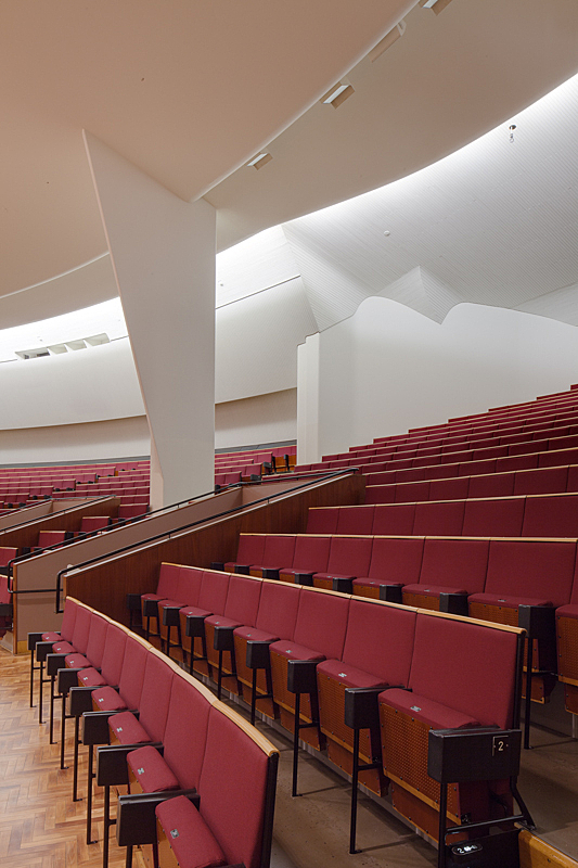 Row of read seats in the concert hall