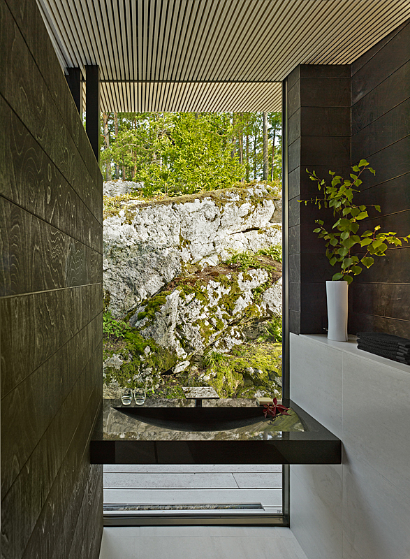 View from a black and white interior to the rocky landscape
