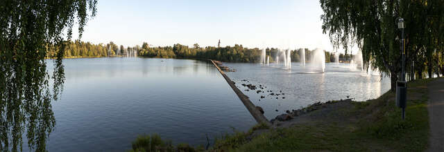 Panorama of a river with a dam in the middle