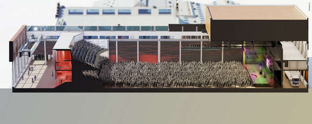 Section picturing the auditorium with a majority of standing places in front of a stage