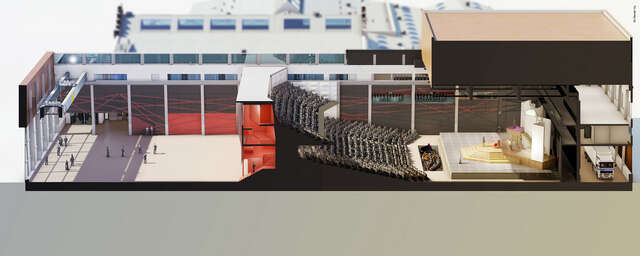 Section picturing the auditorium with seats in two levels and an orchestra in front of a stage