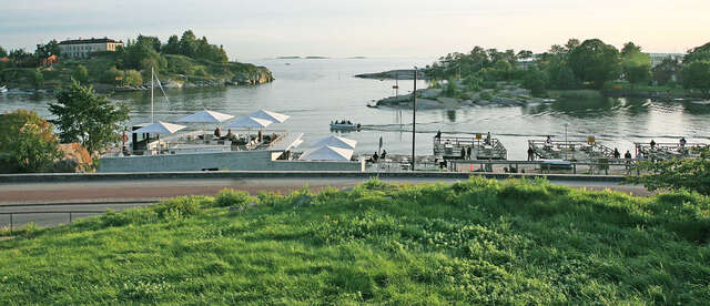 Sea view, outdoor café and white umbrellas