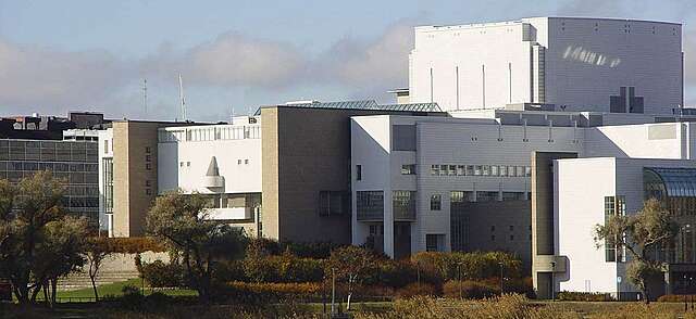 Facade of the opea house from an angle on an autumn day.