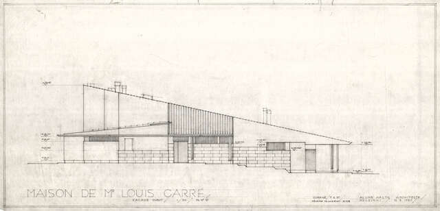 Building with a slanted roof and brick elements