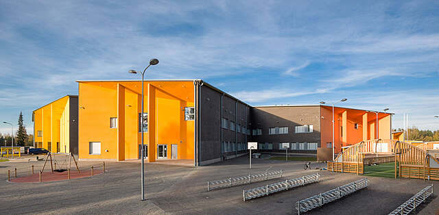 School yard and a orange facade.