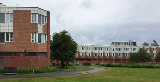 Brick and tile facade of Himmeli. Each window has its own bay.
