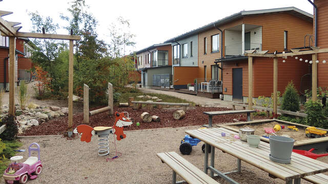 Wooden houses with playground.