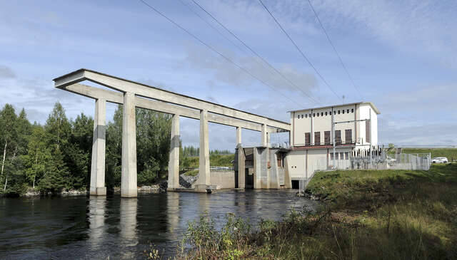 Photo of the hydropower plant in the landscape.