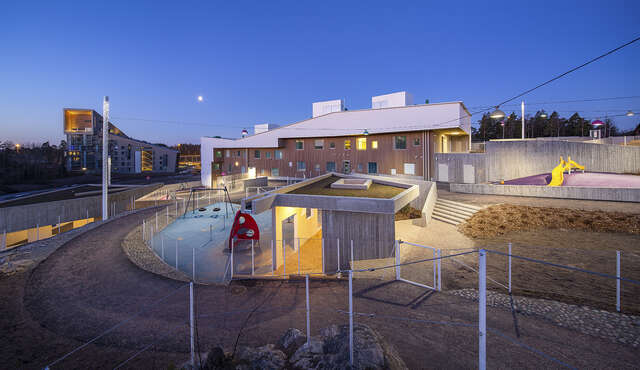 Illuminated playground during the evening.