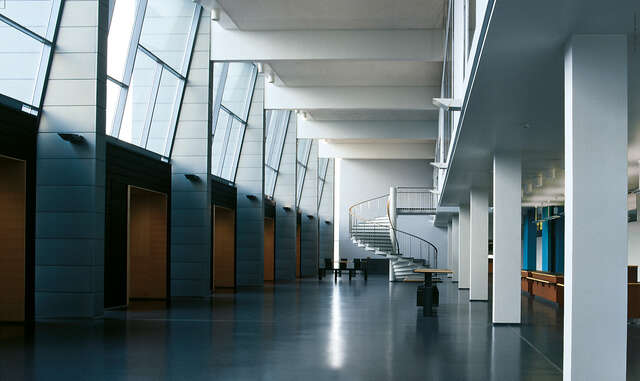 Hallway with tilted windows at the top.