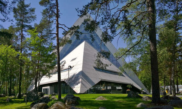 Modernist concrete church surrounded by woods