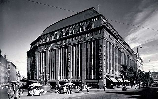 Black and white picture of the red-brick facade of the stockman department store.