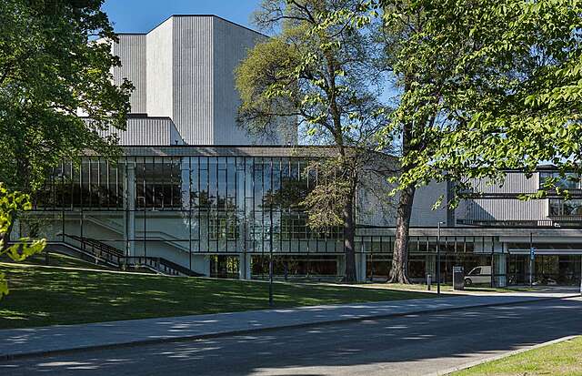 Modern facade of the Helsinki City there with glass and ceramic tile elements on a sunny day.