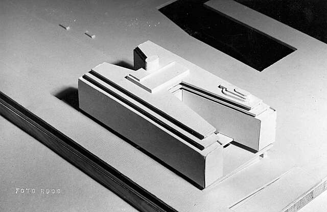 H shaped miniature building.