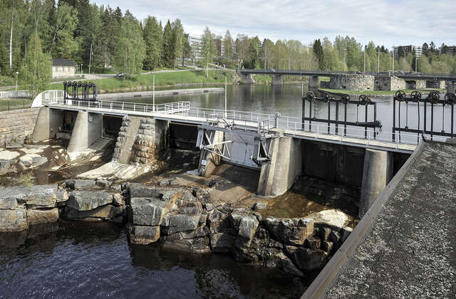 Photo of the spillwater gates with water flowing through.