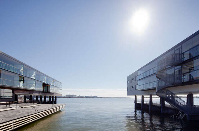 Two modern apartment buildings built on docks with direct access to the sea.