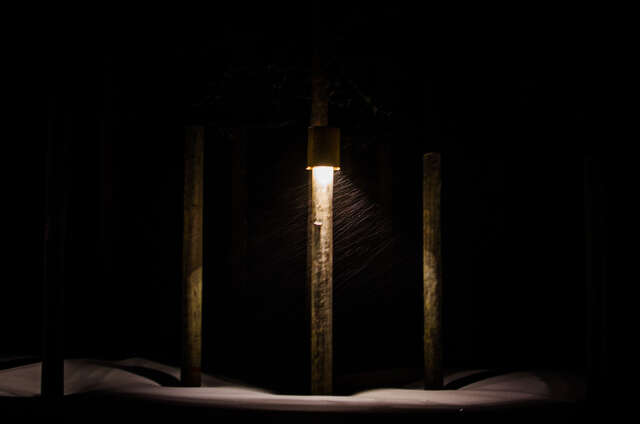 Single light pole in darkness