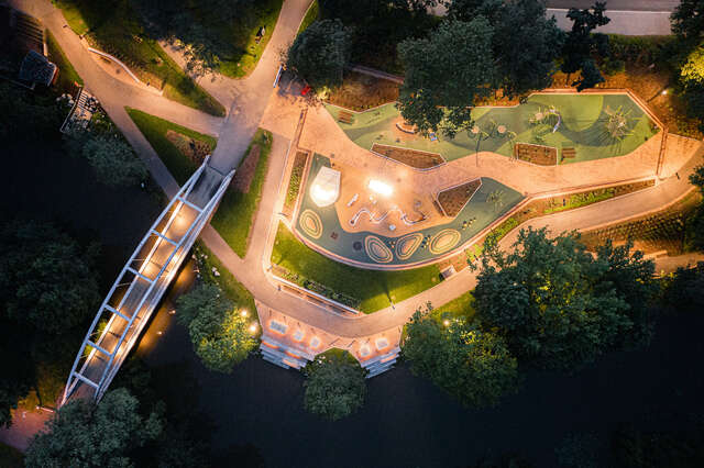 An aerial view of an outdoor area lit at nighttime