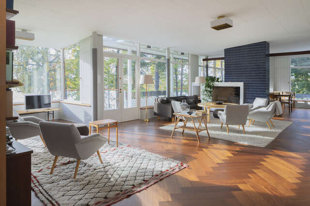 A room in a wooden cabin lit up by natural light