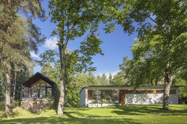 Two wooden structures in a yard