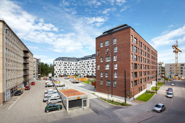 Housing block with red-brick and white façades