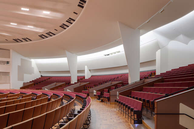 Red seat rows and hallway of the concert hall