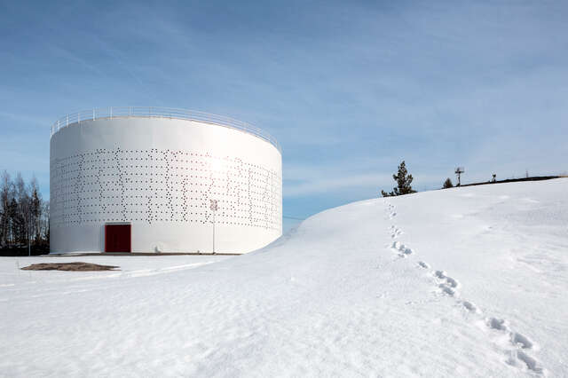 White silo in snowy landscape