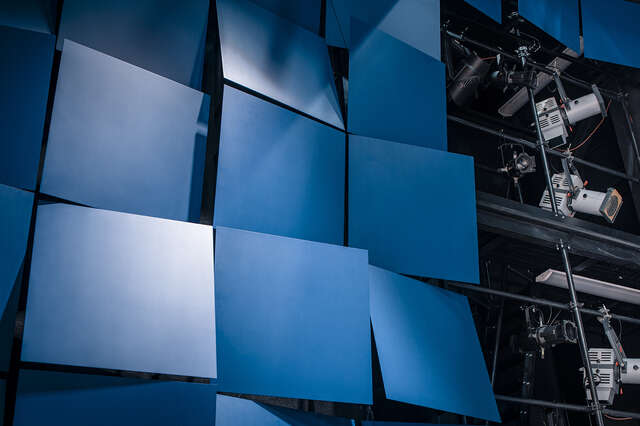 Blue squares on a wall.