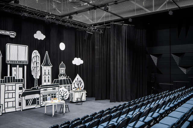 Small stage with city props.