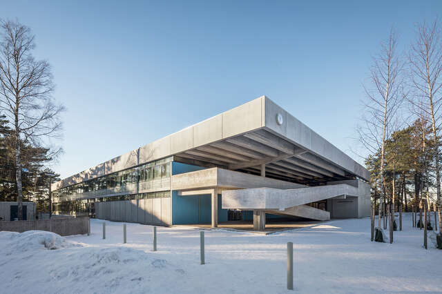 Concrete school building on a snowy day.