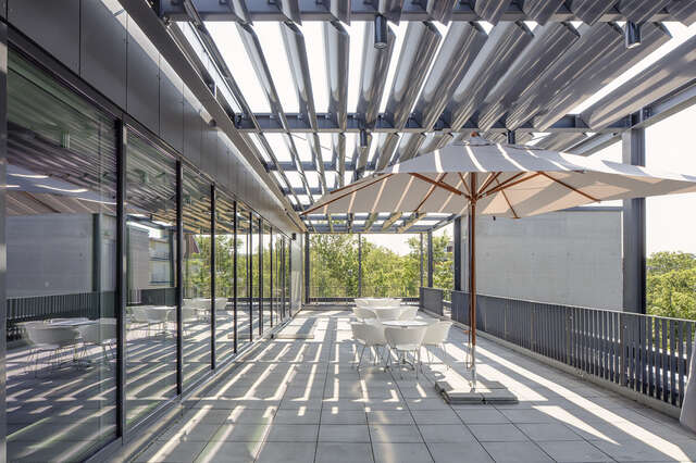 Large balcony in an industrial style environment.