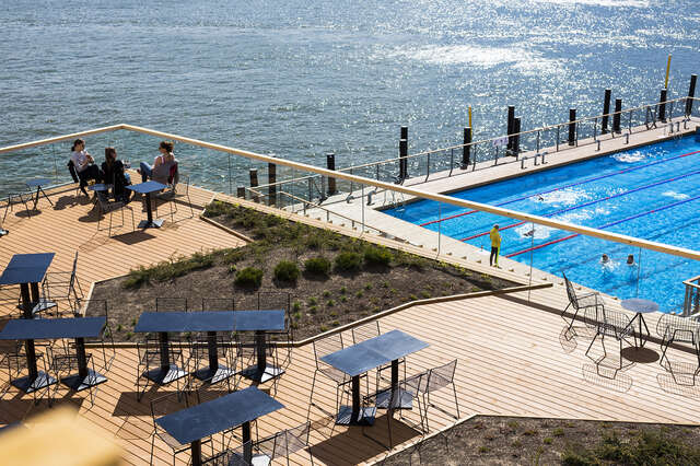 Terrace and swimming pool next to the ocean.