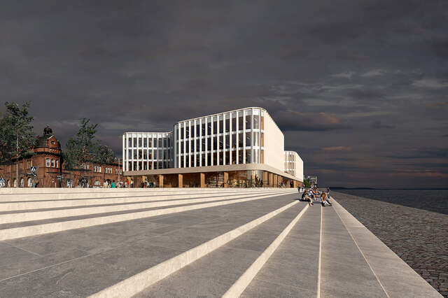 Entire building seen from outside. Shoreline in the foreground.