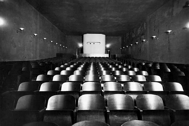 Cinema chairs and the back of the room.