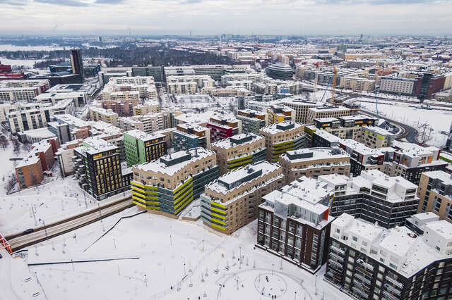 Aerial view of the Jätkäsaari district in Helsinki, a park in front of the housing blocks.