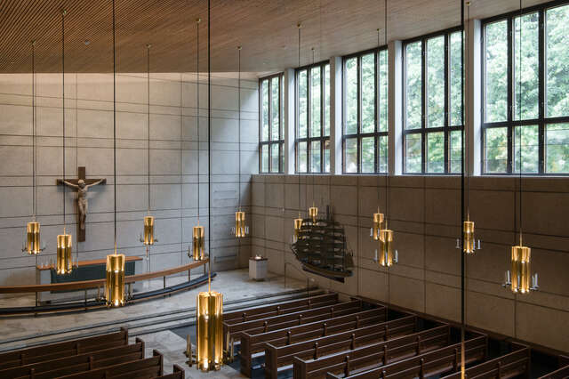 A church chapel seen from ceiling level looking down at the altar and pews.
