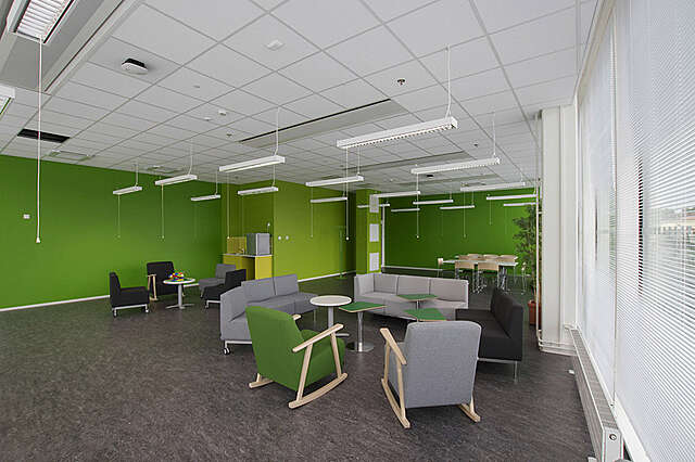 Seating area with green walls.