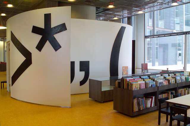 Children's bookshelf next to a white sound structure.