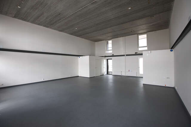 Empty white and concrete room.