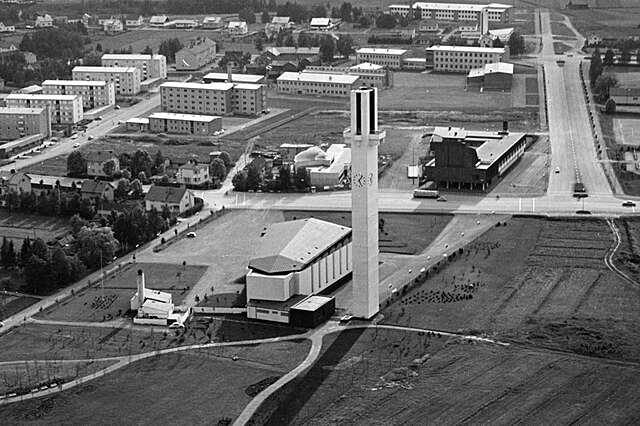 black and white aerial view of the church and nearby lands and buildings
