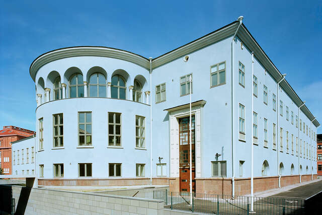 Pastel blue exterior of a classical building