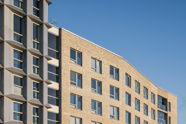 Large apartment building and blue sky