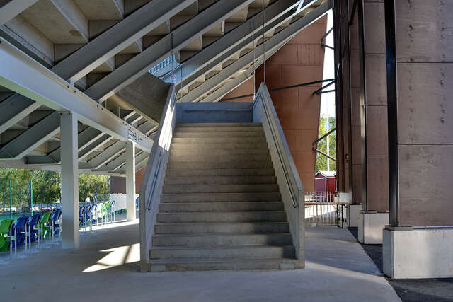 Concrete stairs leading to the second level of the stands.