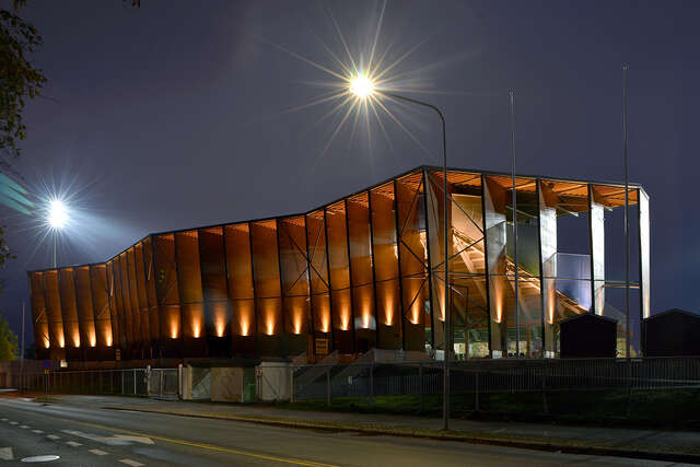 Illuminated back of the spectator stands on an evening.