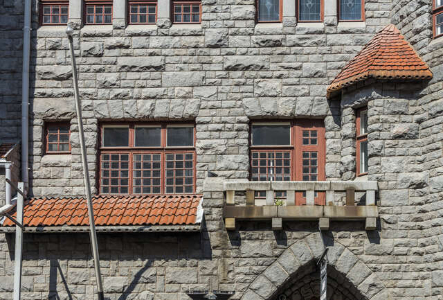Grid windows with brown frames.