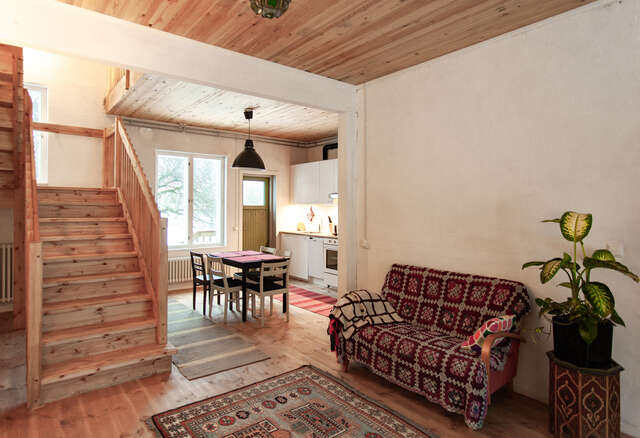 Living space in a building with a staircase and a sofa.