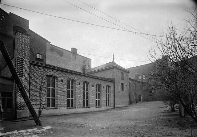 Red brick building and bushes